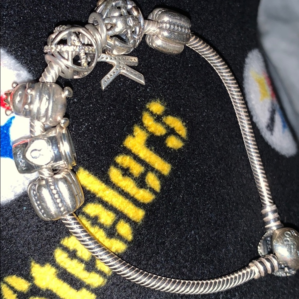 Pandora bracelet with 7 charms initial “K”